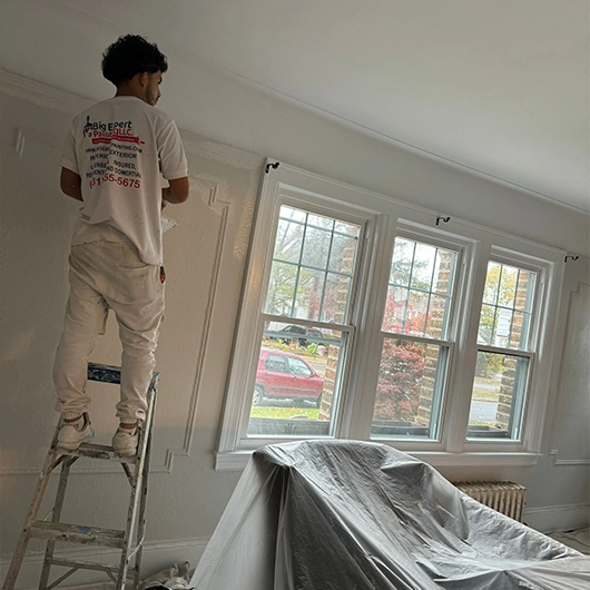 Homeowner reviewing interior paint color samples with Big Expert Painting LLC.