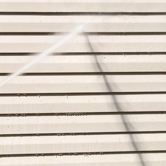 Storefront receiving commercial Power Washing in Amityville, NY to improve curb appeal.