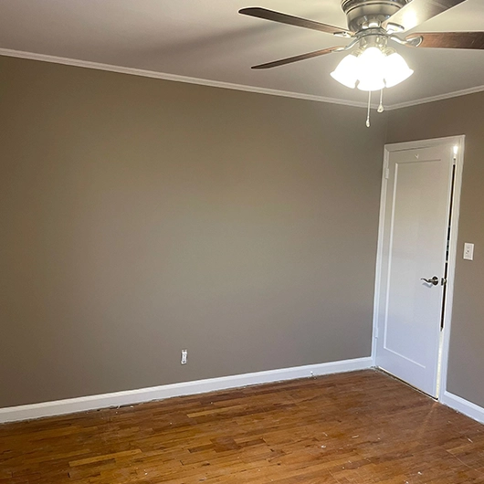 Professional interior painting by a trusted painting company in Long Island, NY transforming a bright living room.