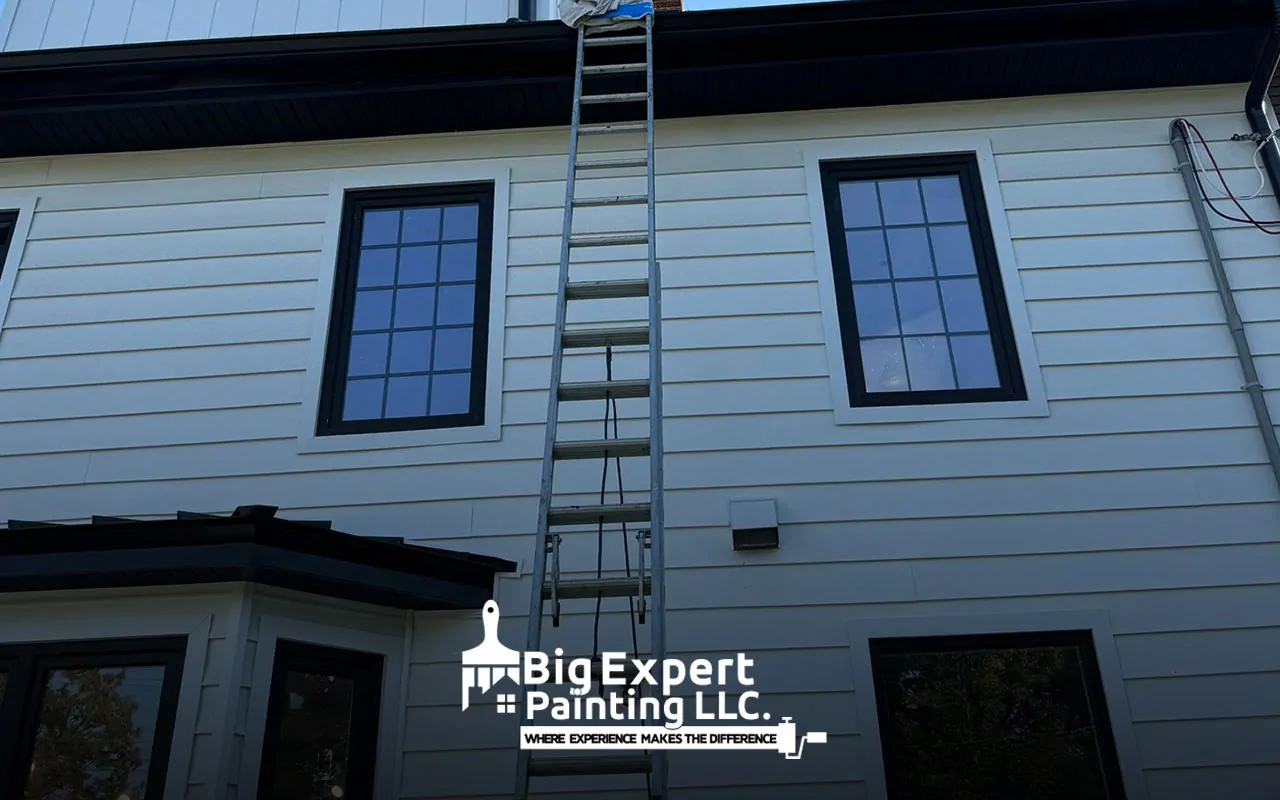 Residential exterior painting project in Amityville showcasing a fresh, vibrant home exterior.
